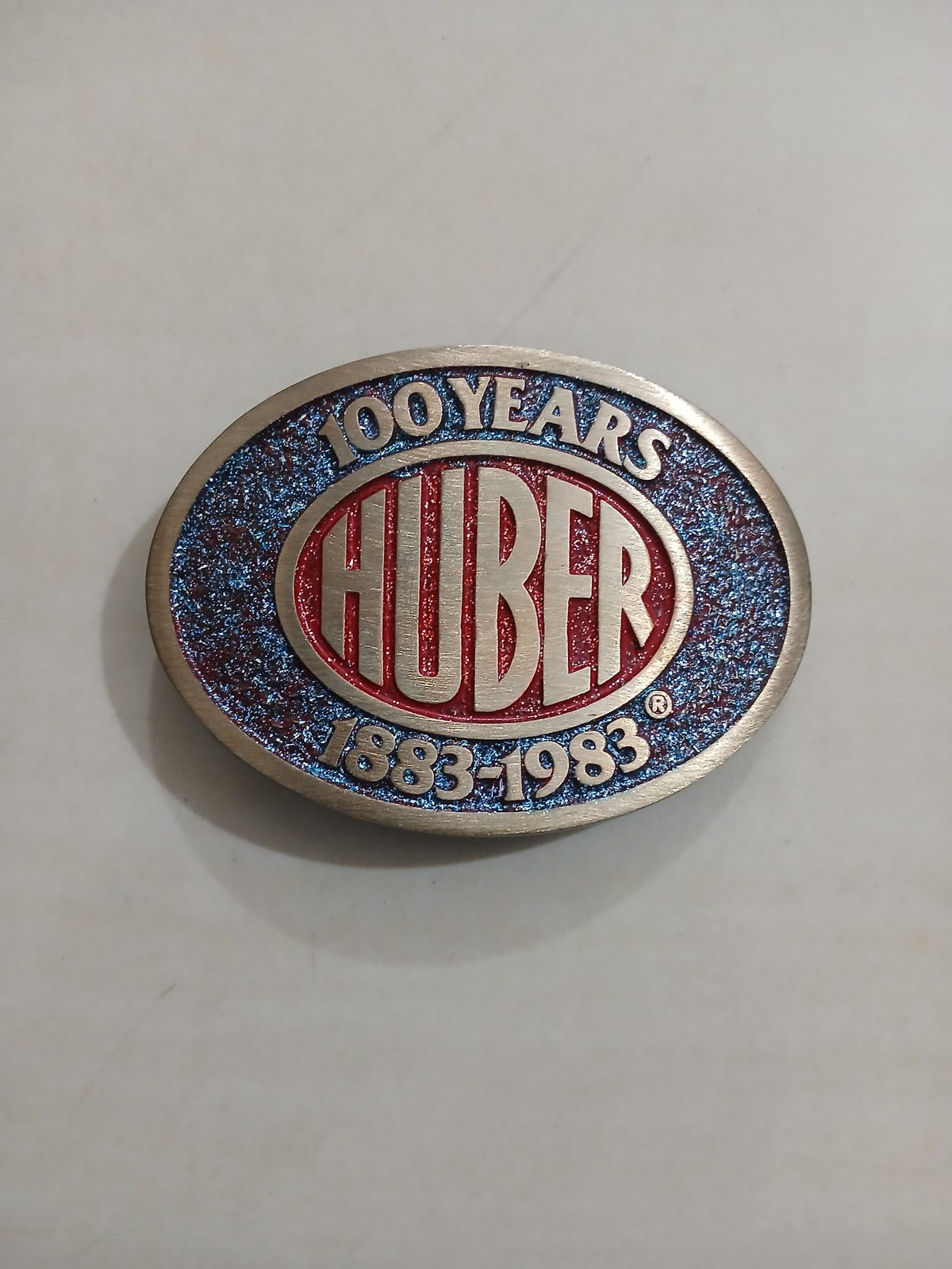 Huber 100 Years 1883-1983 Vintage Belt Buckle – Front view Huber 100 Years 1883-1983 vintage belt buckle – front view