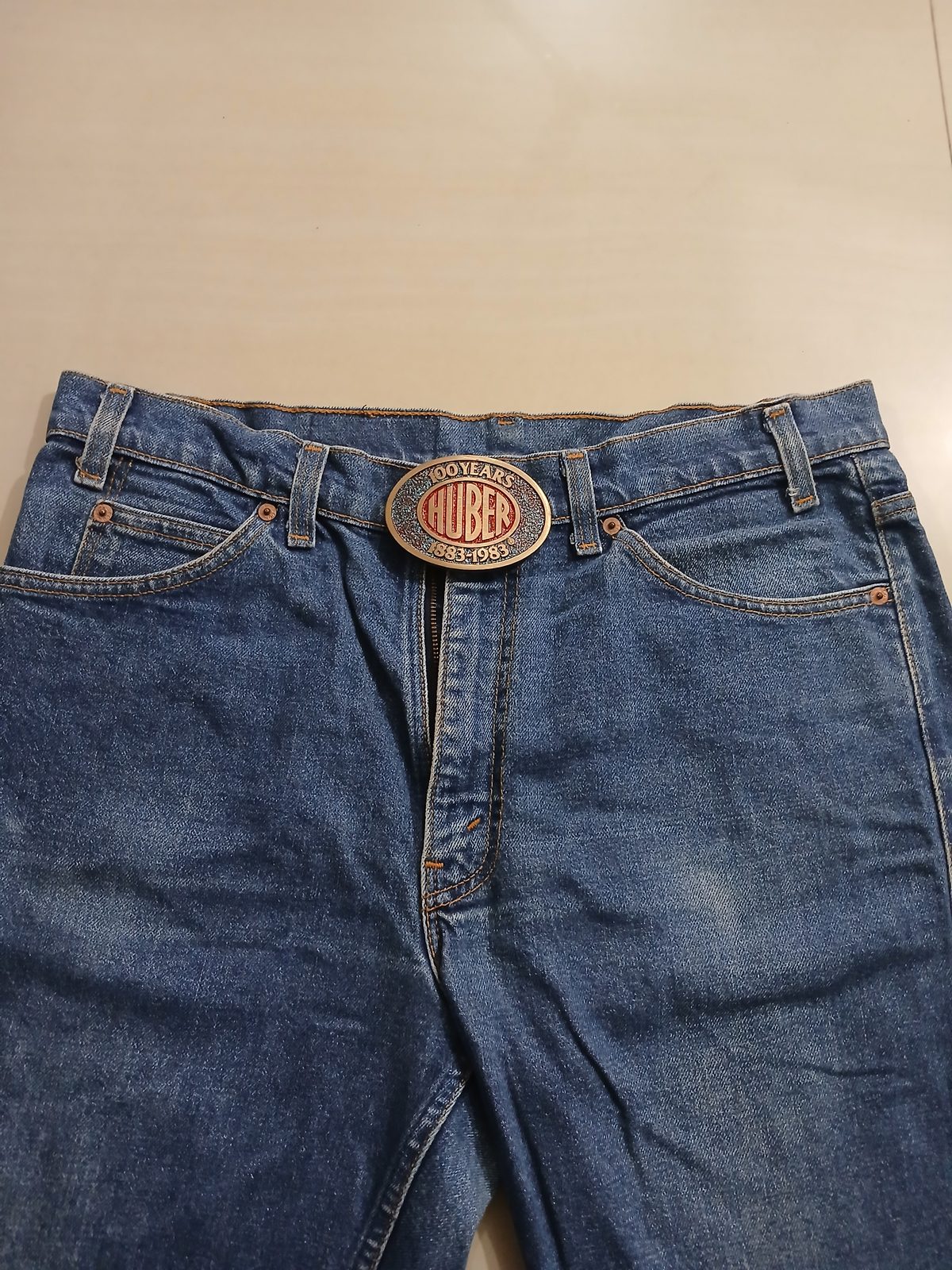 Huber 100 Years 1883-1983 Vintage Belt Buckle – Worn on belt with jeans Huber 100 Years 1883-1983 vintage belt buckle – worn on belt with jeans