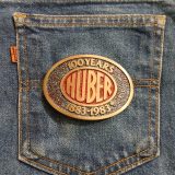 Huber 100 Years 1883-1983 vintage belt buckle – on jeans back pocket