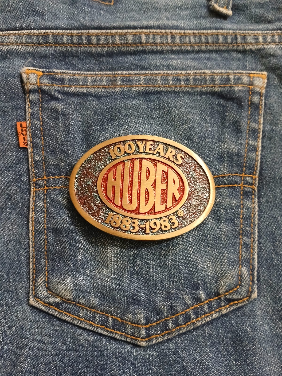 Huber 100 Years 1883-1983 Vintage Belt Buckle – On jeans back pocket Huber 100 Years 1883-1983 vintage belt buckle – on jeans back pocket