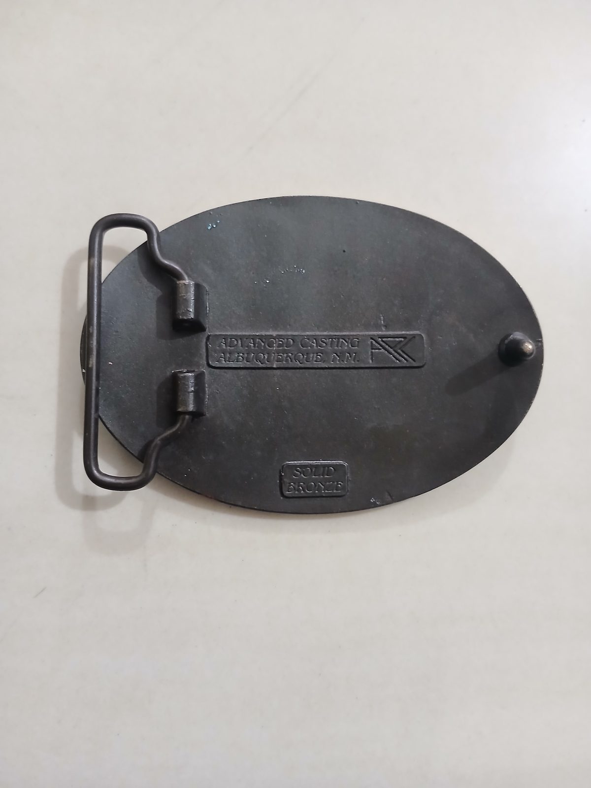 Huber 100 Years 1883-1983 Vintage Belt Buckle – Back view Huber 100 Years 1883-1983 vintage belt buckle – back view