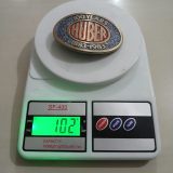 Huber 100 Years 1883-1983 vintage belt buckle – on scale showing weight