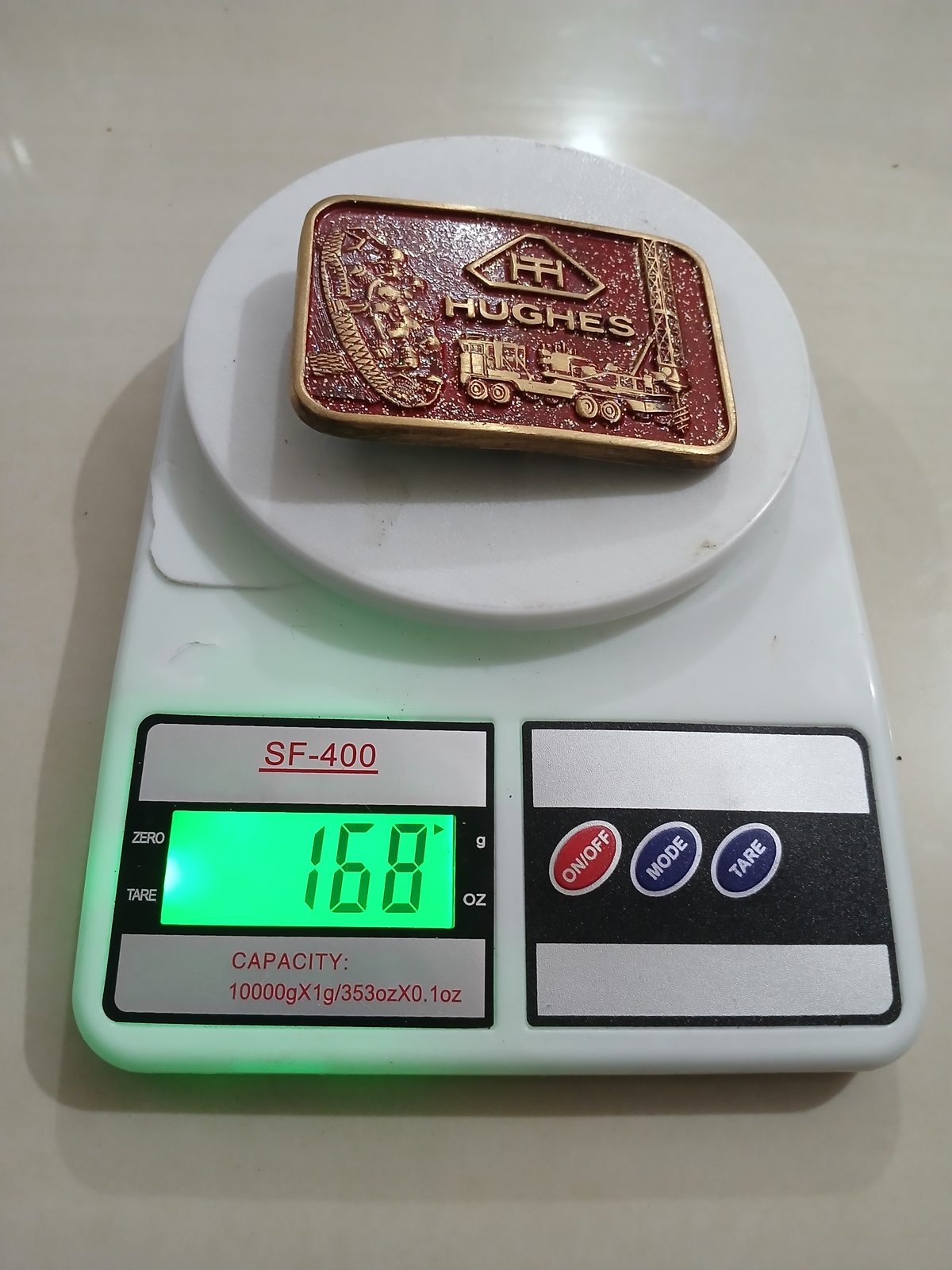 Hughes Vintage Belt Buckle – On scale showing weight Hughes vintage belt buckle – on scale showing weight