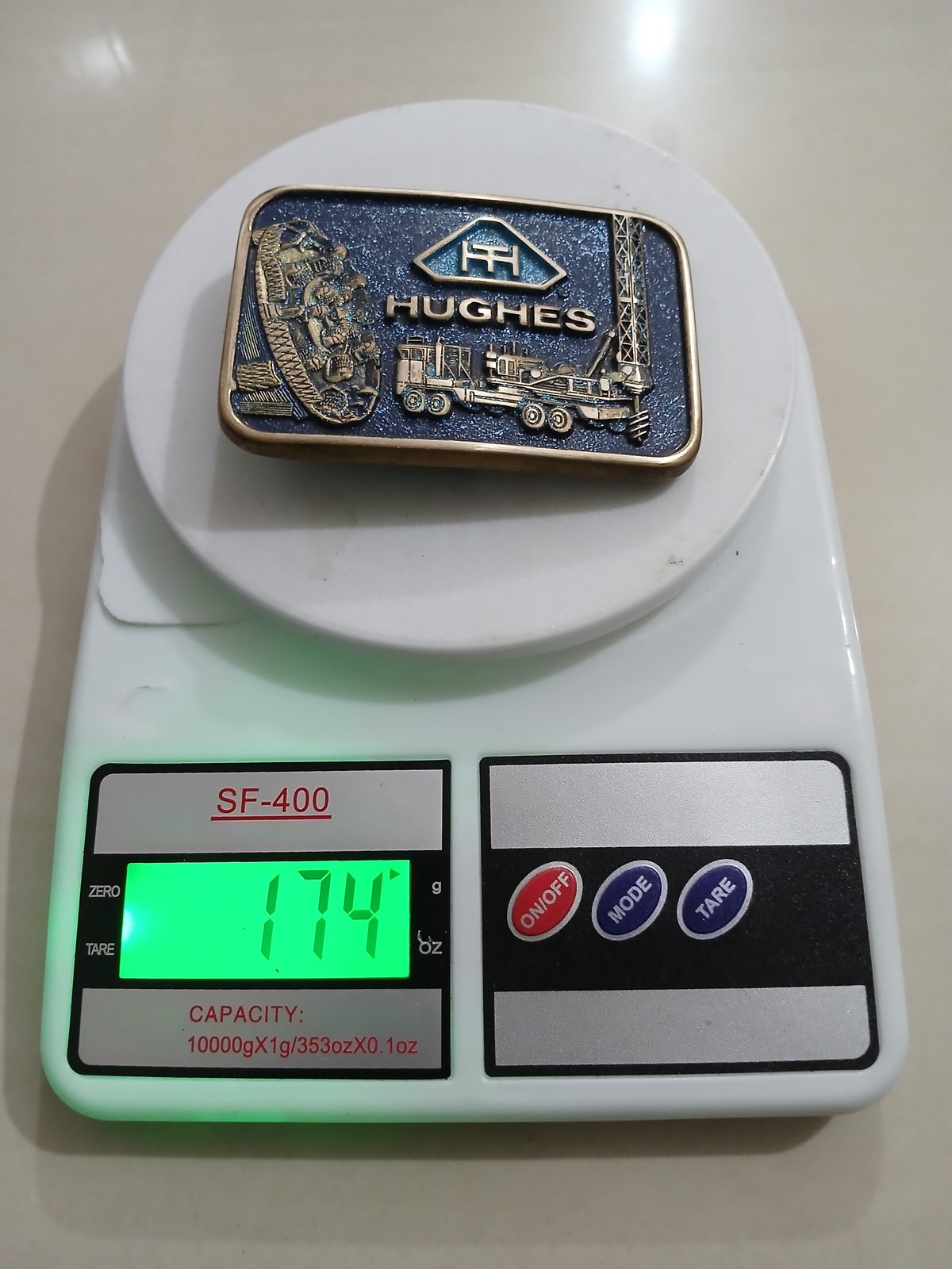 Hughes Vintage Belt Buckle – On scale showing weight Hughes vintage belt buckle – on scale showing weight