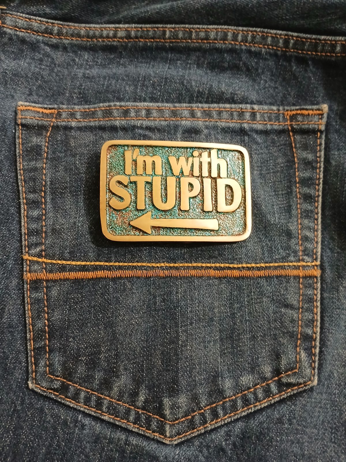 Im With Stupid Vintage Belt Buckle – On jeans back pocket Im With Stupid vintage belt buckle – on jeans back pocket
