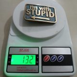 Im With Stupid vintage belt buckle – on scale showing weight