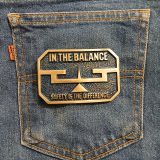 In The Balance Safety Is The Difference vintage belt buckle – on jeans back pocket