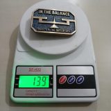 In The Balance Safety Is The Difference vintage belt buckle – on scale showing weight