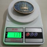Industrial Cleaning and Coating Offshore Operations vintage belt buckle – on scale showing weight
