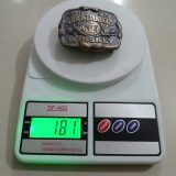 Jack Daniels Whiskey vintage belt buckle – on scale showing weight