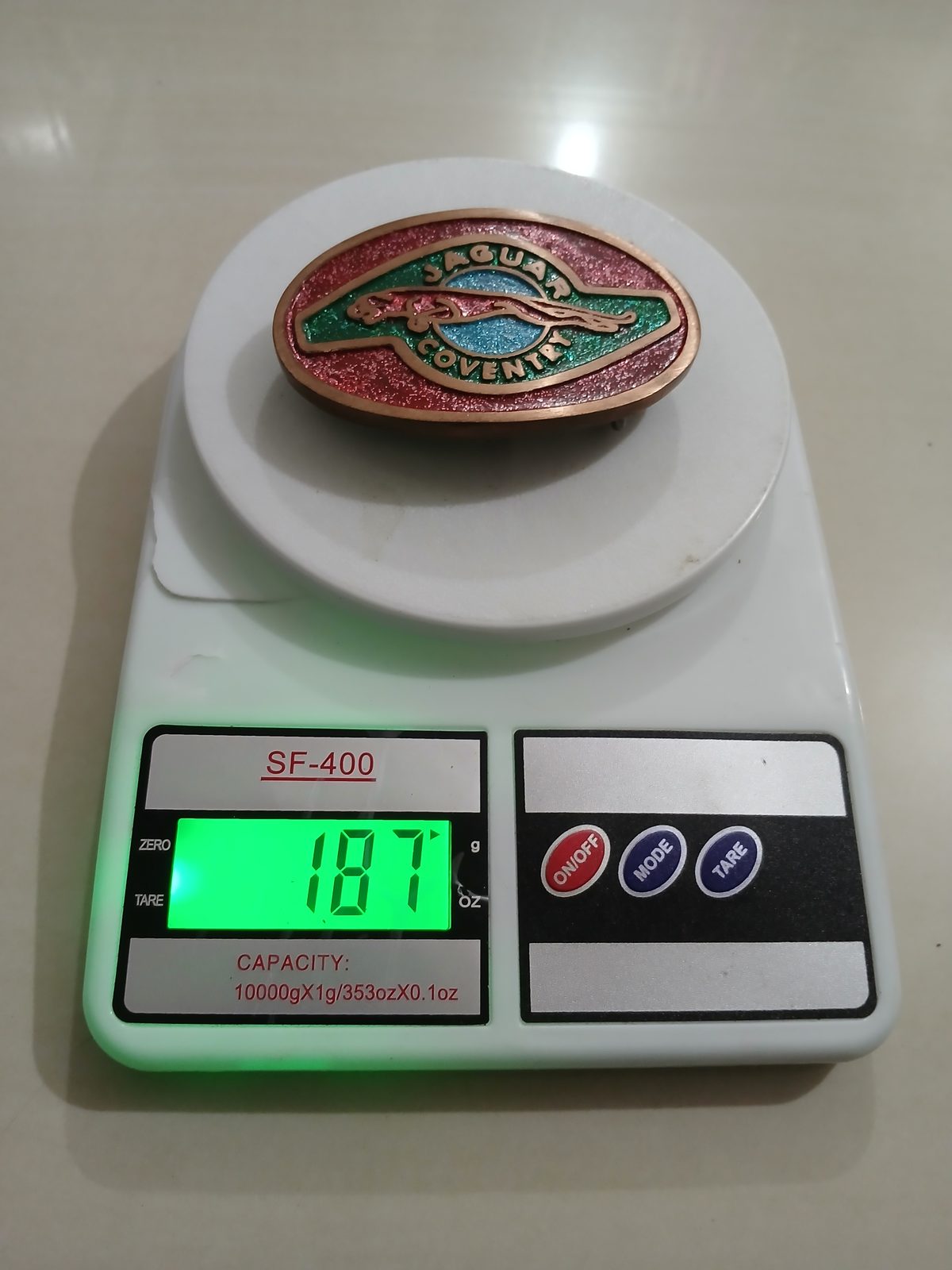 Jaguar Coventry Vintage Belt Buckle – On scale showing weight Jaguar Coventry vintage belt buckle – on scale showing weight