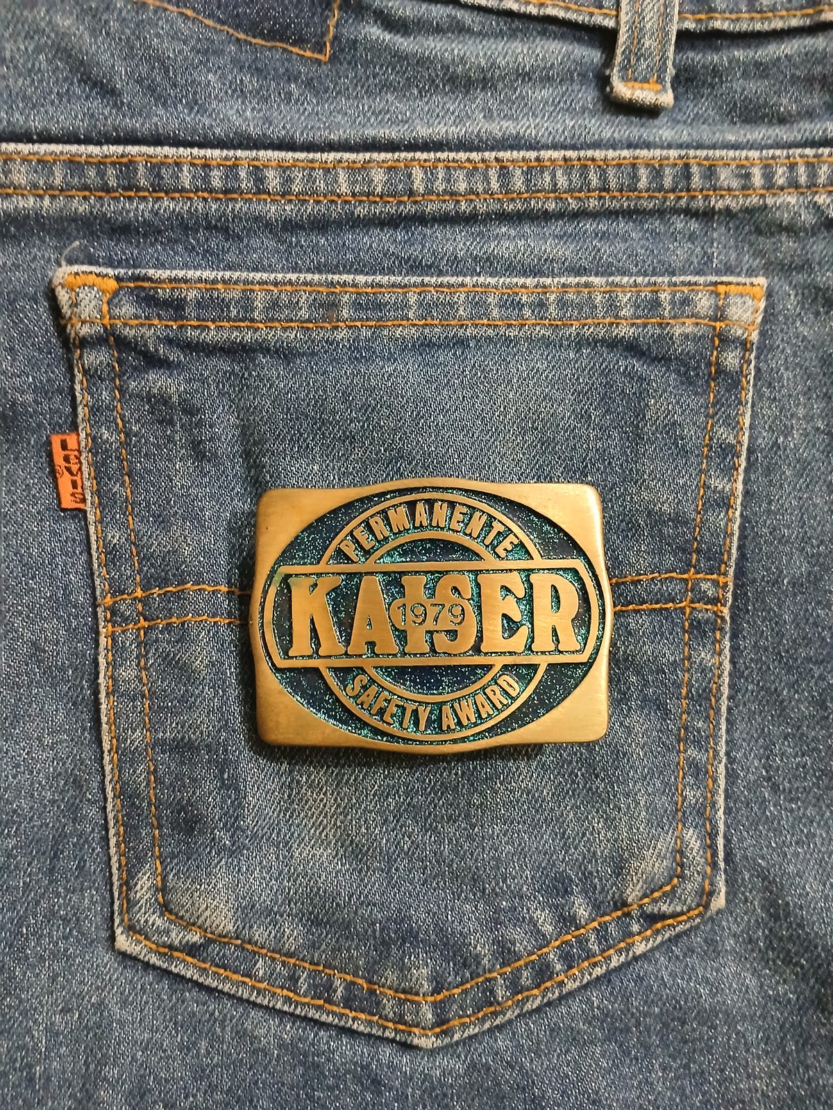Kaiser Permanente 1979 Safety Award Vintage Belt Buckle – On jeans back pocket Kaiser Permanente 1979 Safety Award vintage belt buckle – on jeans back pocket