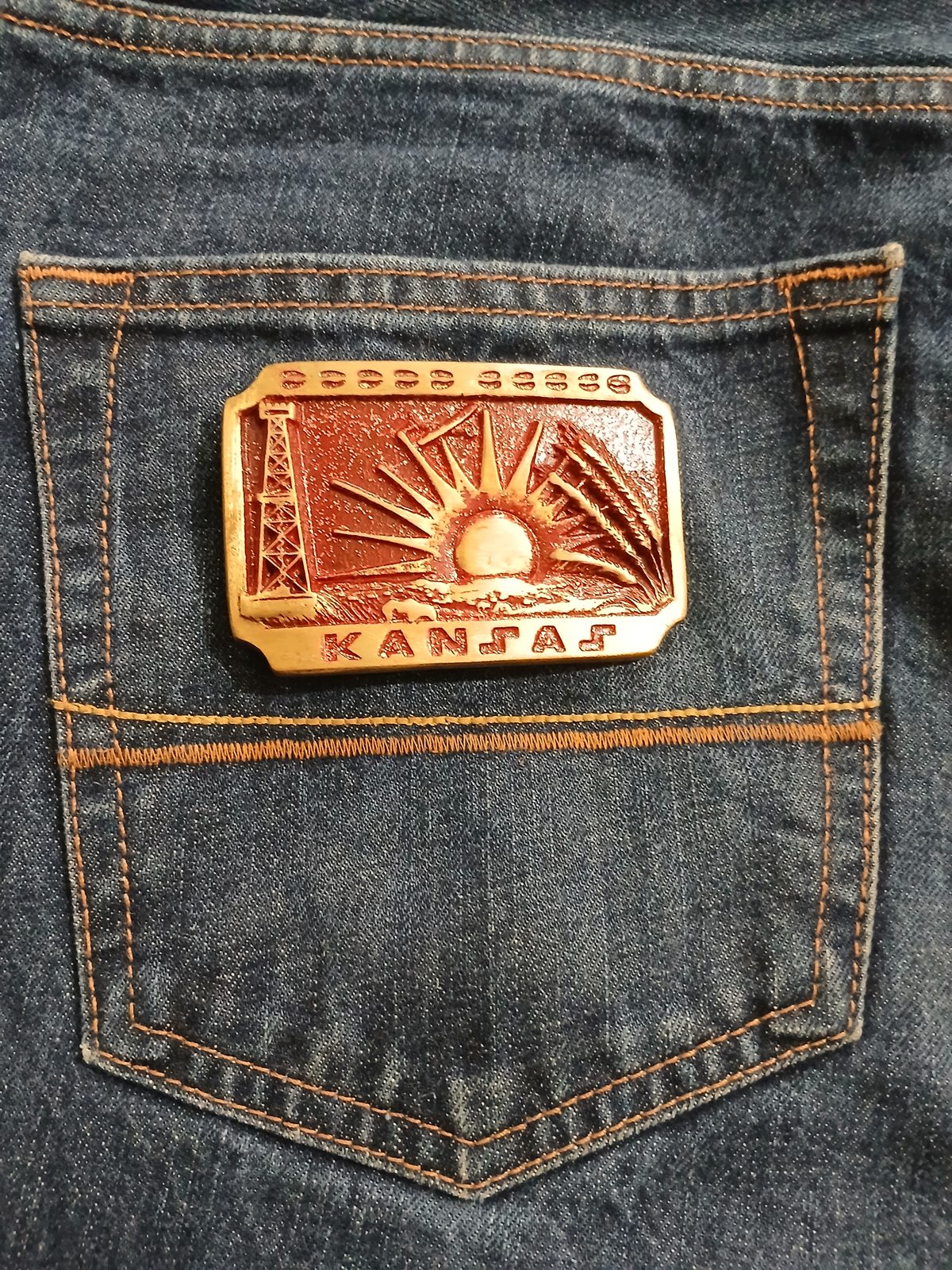 Kansas Sunflower Vintage Belt Buckle – On jeans back pocket Kansas Sunflower vintage belt buckle – on jeans back pocket