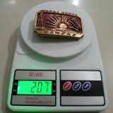 Kansas Sunflower vintage belt buckle – on scale showing weight