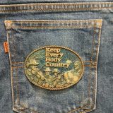 Keep Every Body Country FM94 OKC vintage belt buckle – on jeans back pocket