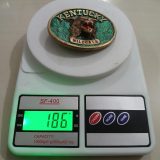 Kentucky Wildcats vintage belt buckle – on scale showing weight