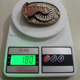 Las Vegas vintage belt buckle – on scale showing weight