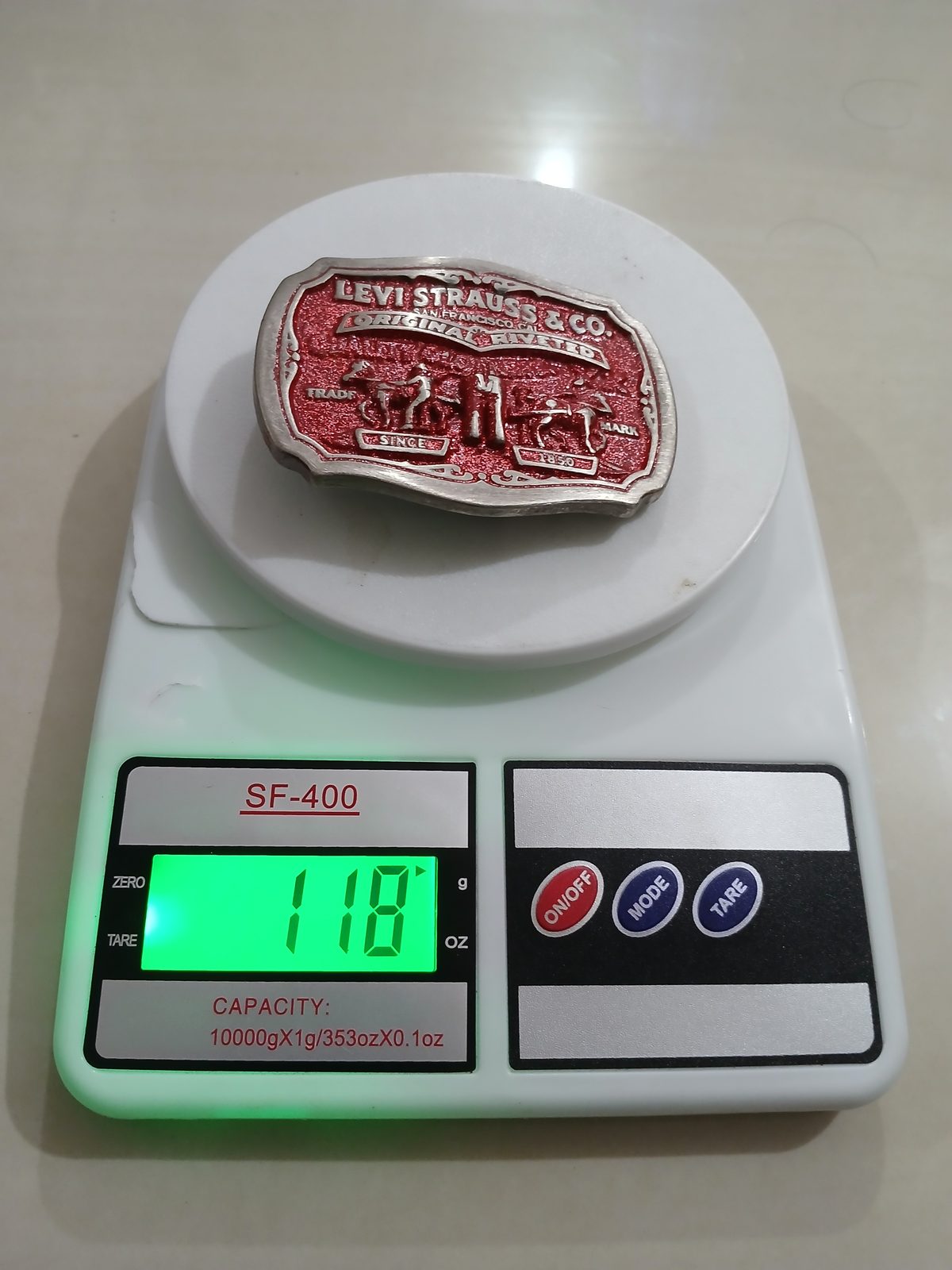 Levi Strauss Original Riveted Vintage Belt Buckle – On scale showing weight Levi Strauss Original Riveted vintage belt buckle – on scale showing weight