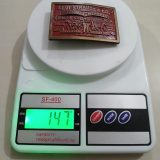 Levi Strauss Quality Clothing vintage belt buckle – on scale showing weight