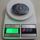 Lions International vintage belt buckle – on scale showing weight