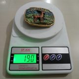 Louisiana Deer vintage belt buckle – on scale showing weight