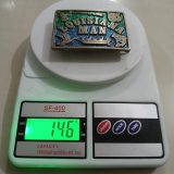 Louisiana Man vintage belt buckle – on scale showing weight