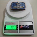 Magnum Tools vintage belt buckle – on scale showing weight