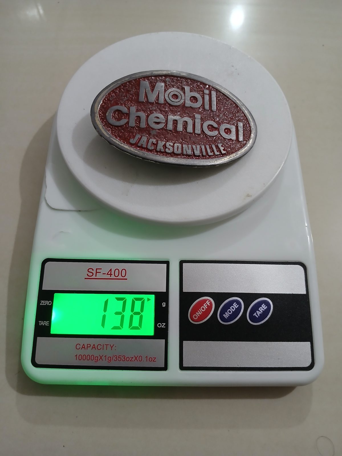 Mobil Chemical Jacksonville Vintage Belt Buckle – On scale showing weight Mobil Chemical Jacksonville vintage belt buckle – on scale showing weight