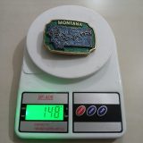 Montana Big Sky Country vintage belt buckle – on scale showing weight