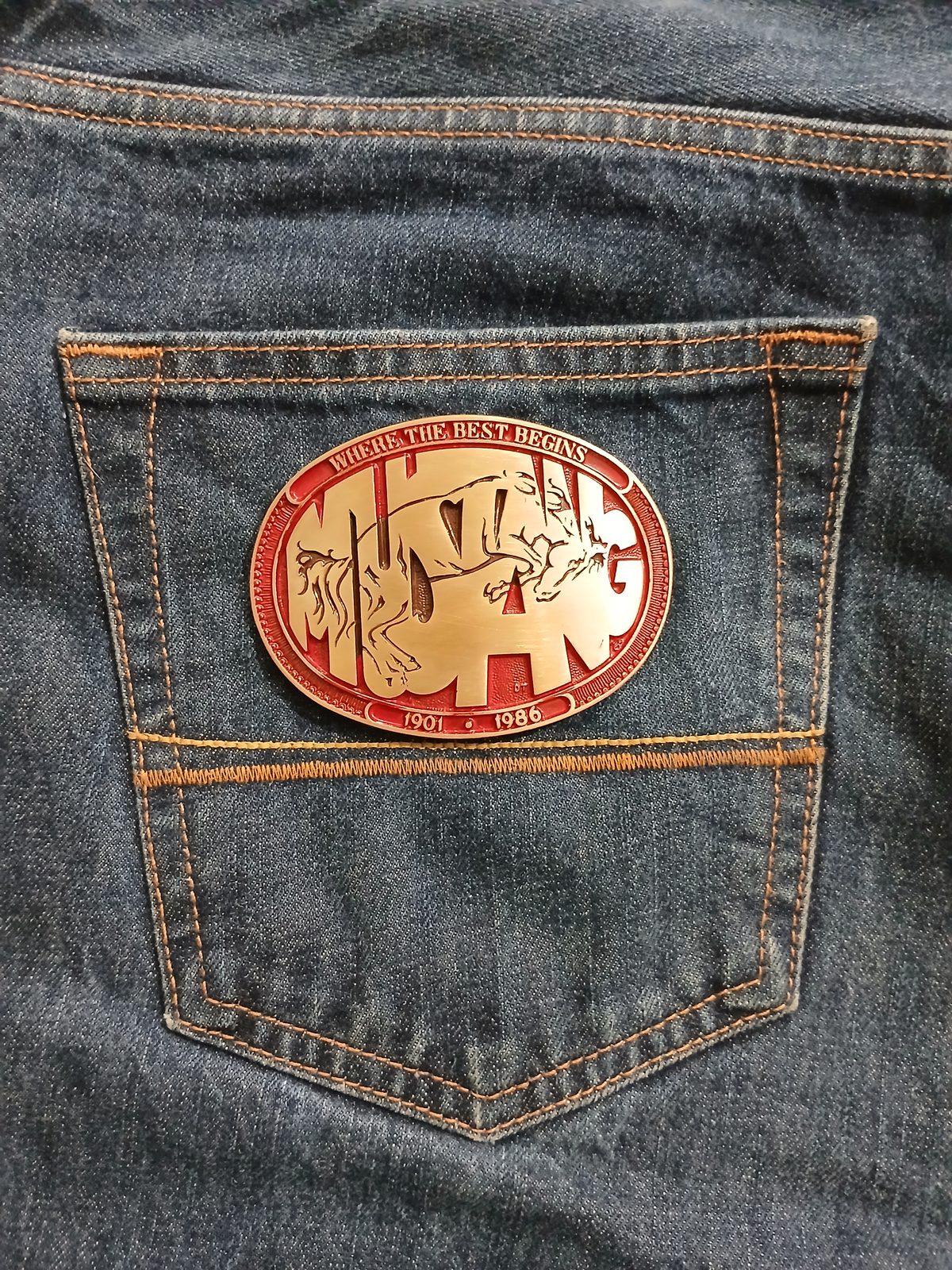 Mustang 1901-1986 Vintage Belt Buckle – On jeans back pocket Mustang 1901-1986 vintage belt buckle – on jeans back pocket