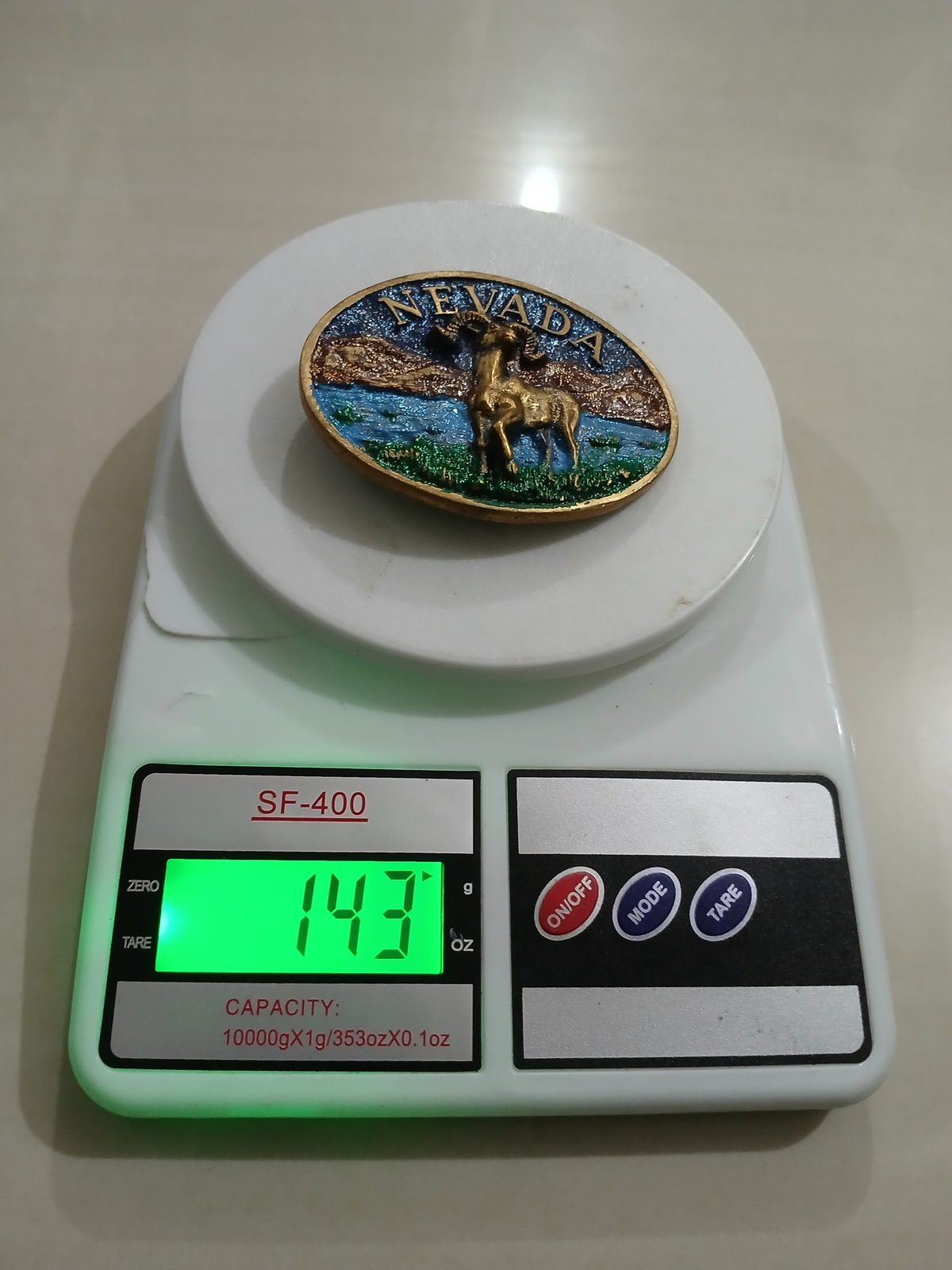 Nevada Bighorn Ram Vintage Belt Buckle – On scale showing weight Nevada Bighorn Ram vintage belt buckle – on scale showing weight