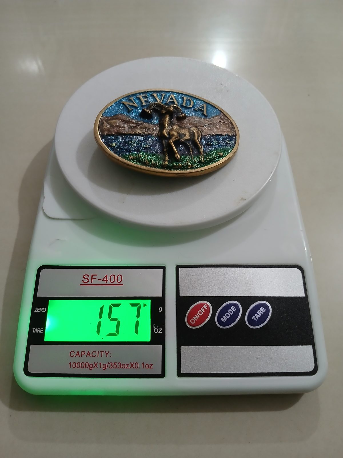 Nevada Bighorn Ram Vintage Belt Buckle – On scale showing weight Nevada Bighorn Ram vintage belt buckle – on scale showing weight