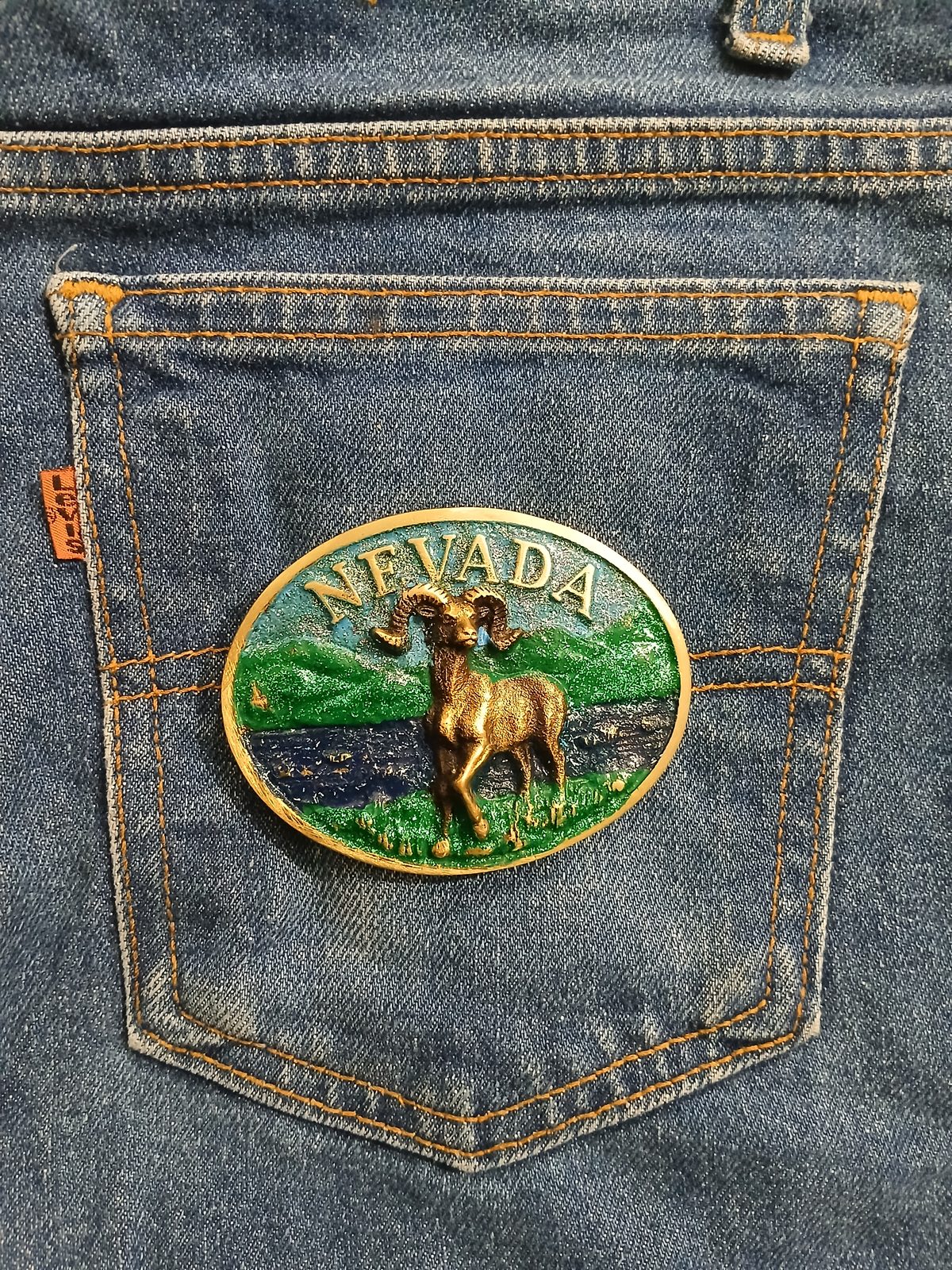 Nevada Bighorn Ram Vintage Belt Buckle – On jeans back pocket Nevada Bighorn Ram vintage belt buckle – on jeans back pocket