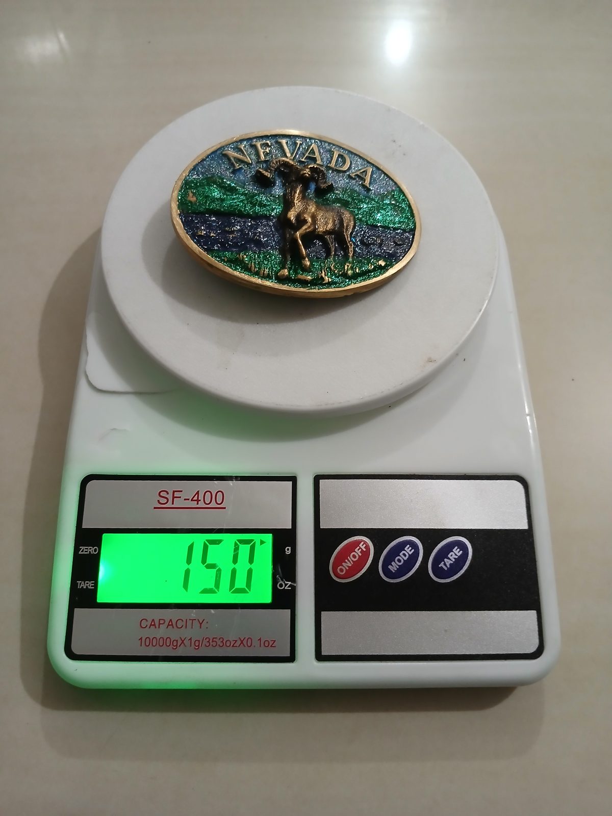 Nevada Bighorn Ram Vintage Belt Buckle – On scale showing weight Nevada Bighorn Ram vintage belt buckle – on scale showing weight