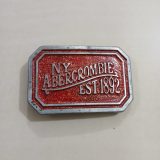 NY Abercrombie Est 1892 Red vintage belt buckle – front view