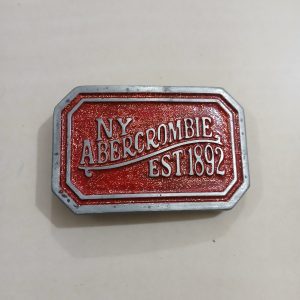 NY Abercrombie Est 1892 Red vintage belt buckle – front view