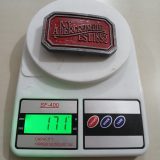 NY Abercrombie Est 1892 Red vintage belt buckle – on scale showing weight