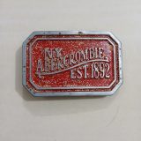NY Abercrombie Est 1892 Red vintage belt buckle – front view