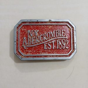 NY Abercrombie Est 1892 Red vintage belt buckle – front view