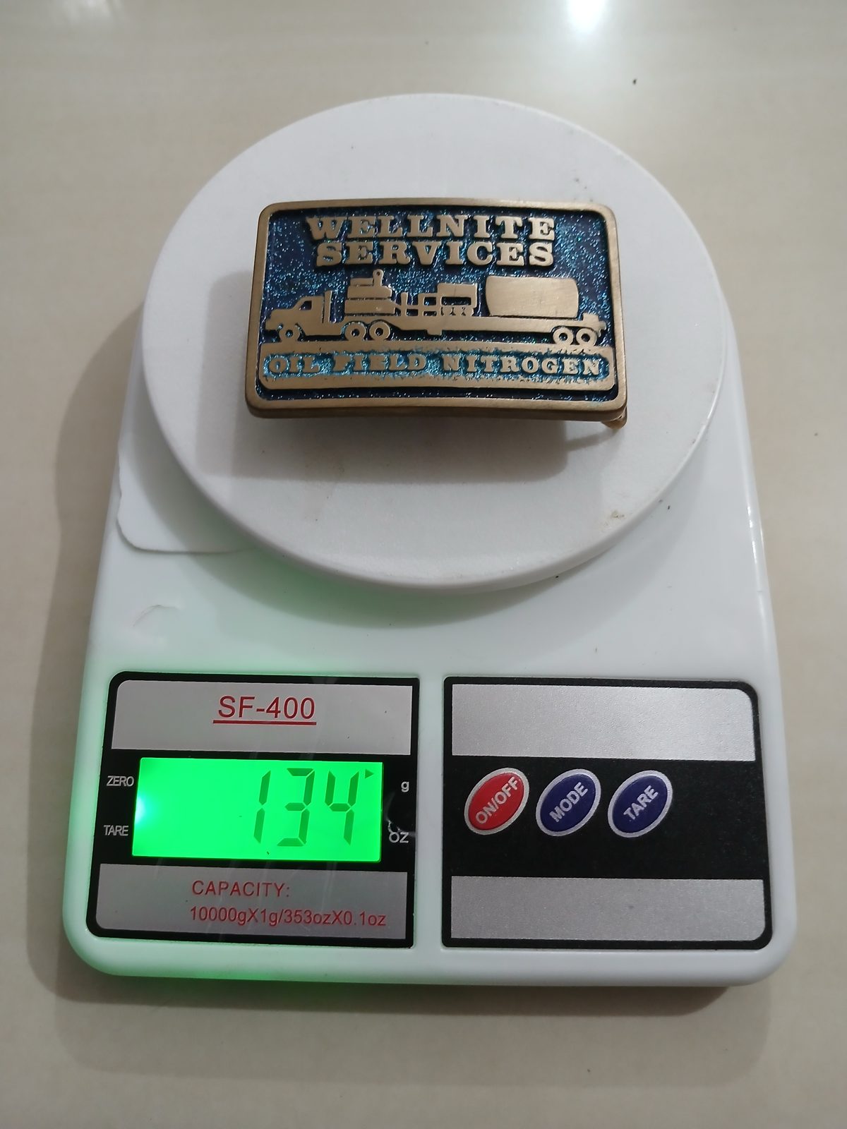 Oil Field Nitrogen Services Vintage Belt Buckle – On scale showing weight Oil Field Nitrogen Services vintage belt buckle – on scale showing weight