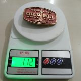 Oilwell Service Supply vintage belt buckle – on scale showing weight