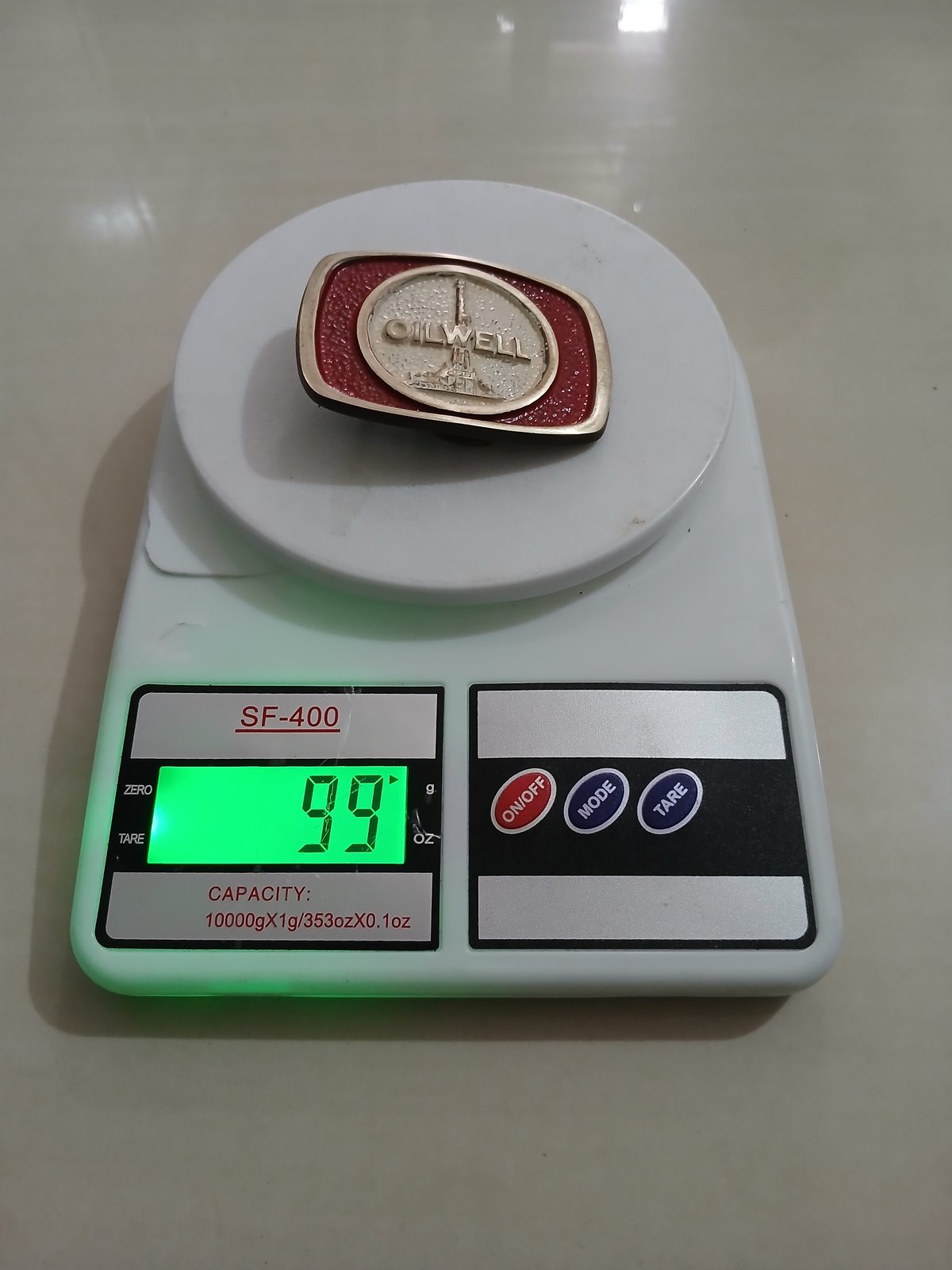 Oilwell Vintage Belt Buckle – On scale showing weight Oilwell vintage belt buckle – on scale showing weight