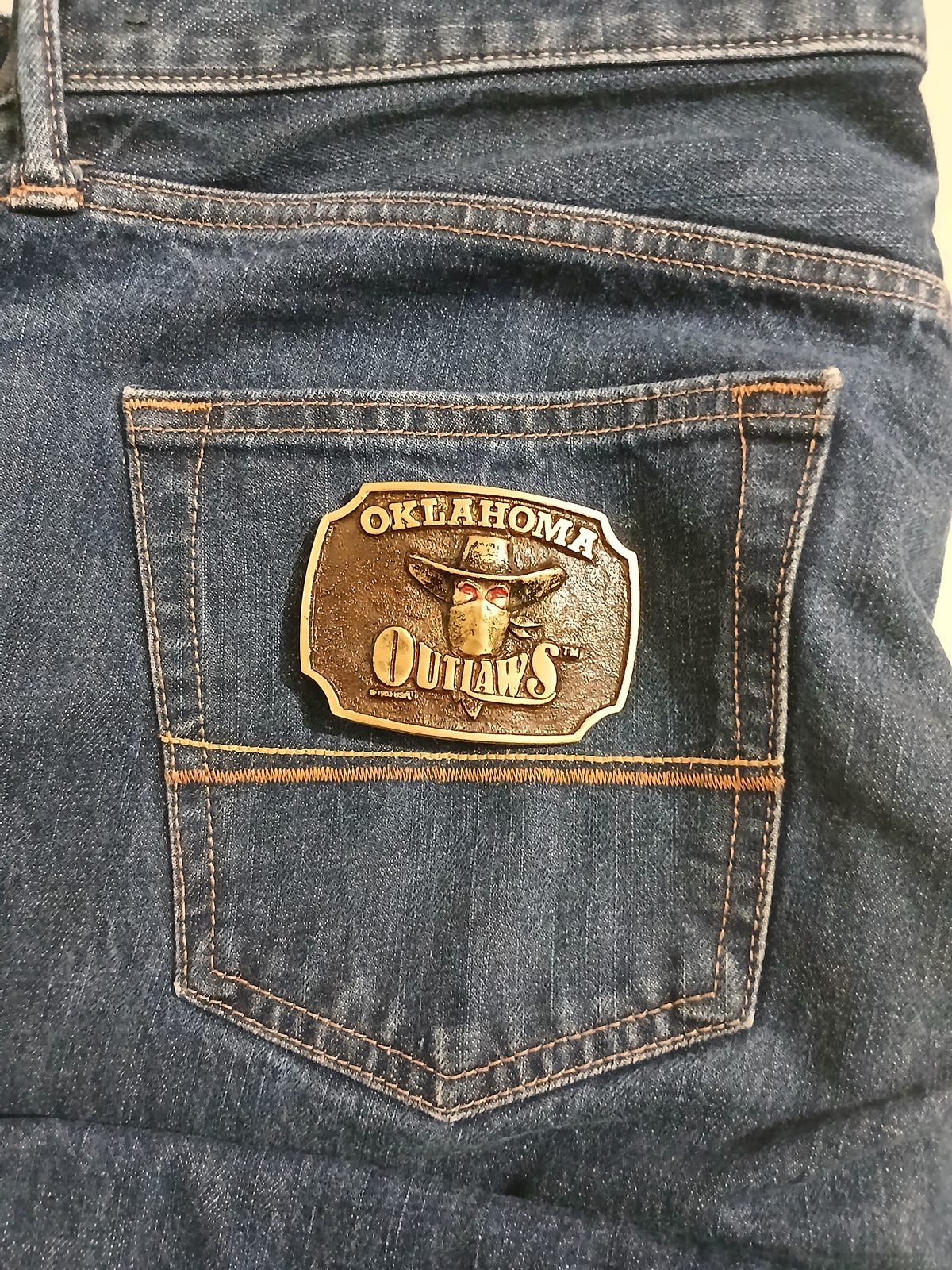 Oklahoma Outlaws Vintage Belt Buckle – On jeans back pocket Oklahoma Outlaws vintage belt buckle – on jeans back pocket