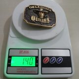 Oklahoma Outlaws vintage belt buckle – on scale showing weight