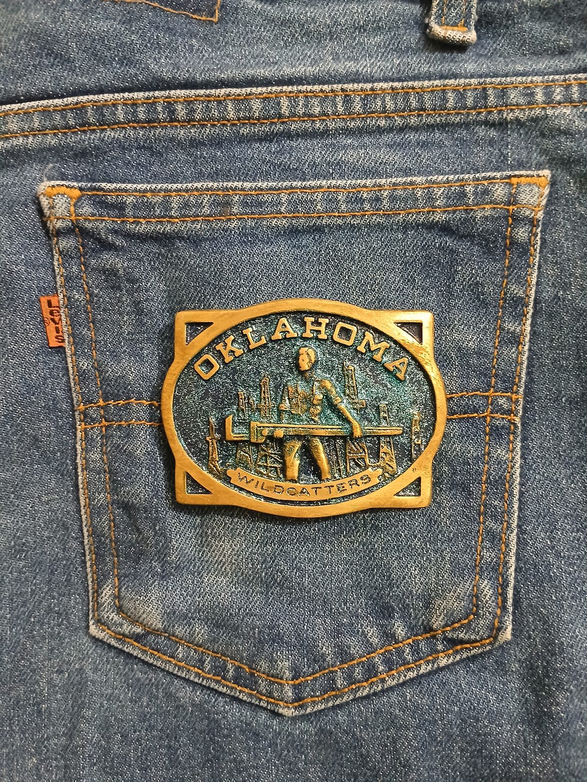 Oklahoma Wildcatters Vintage Belt Buckle – On jeans back pocket Oklahoma Wildcatters vintage belt buckle – on jeans back pocket