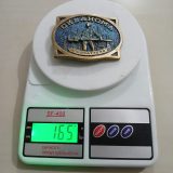 Oklahoma Wildcatters vintage belt buckle – on scale showing weight