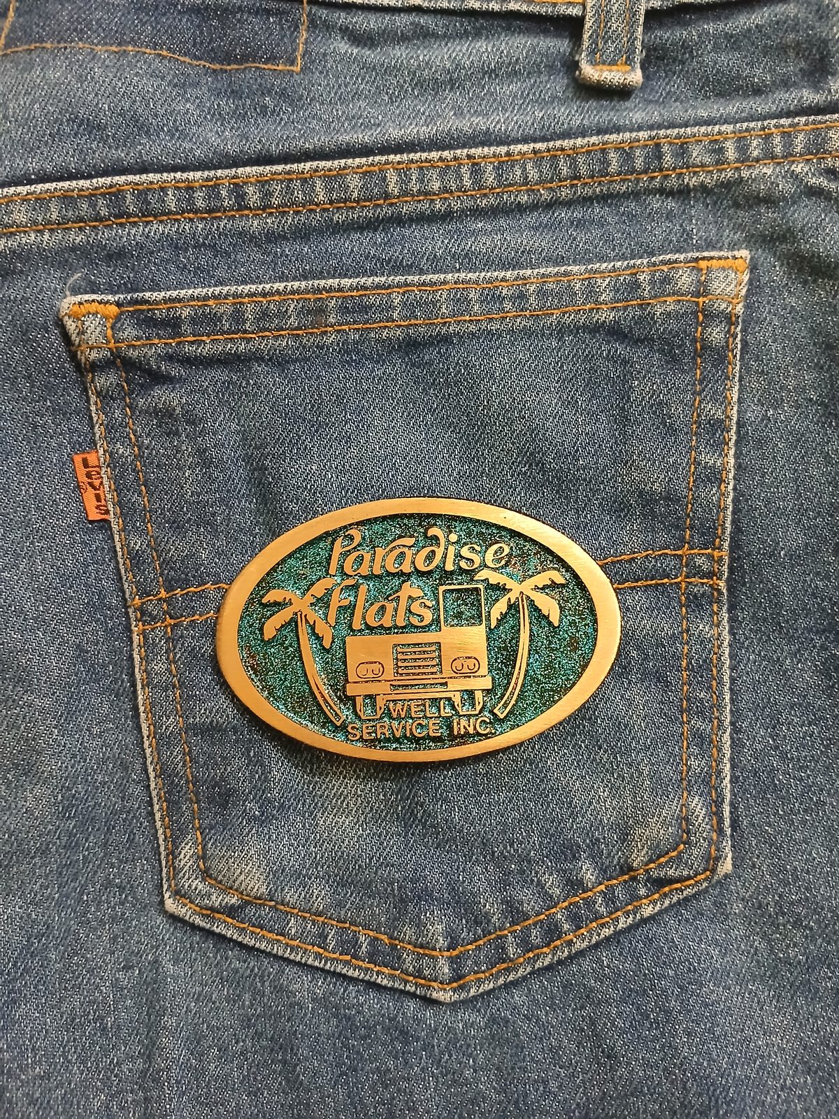 Paradise Flats Well Service Inc Vintage Belt Buckle – On jeans back pocket Paradise Flats Well Service Inc vintage belt buckle – on jeans back pocket