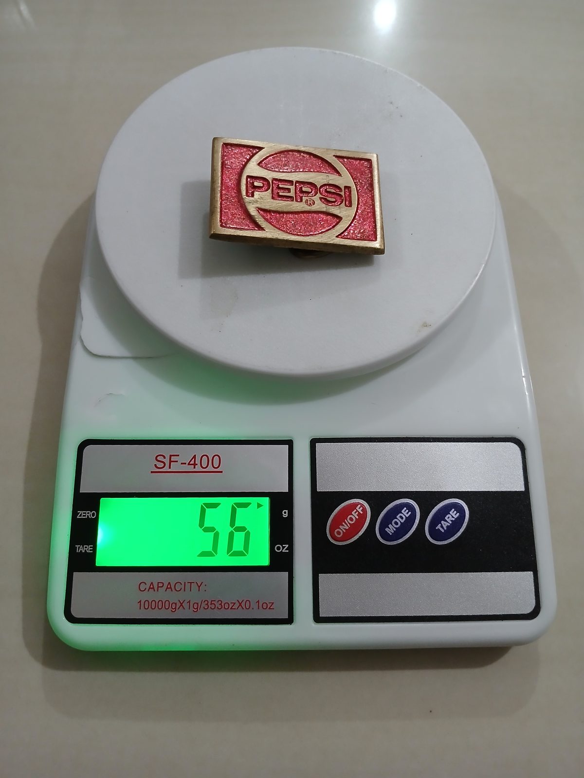 Pepsi Vintage Belt Buckle – On scale showing weight Pepsi vintage belt buckle – on scale showing weight