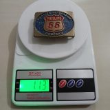 Phillips 66 Petroleum vintage belt buckle – on scale showing weight