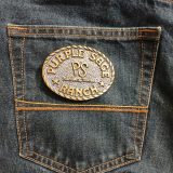 Purple Sage Ranch Bandera Texas vintage belt buckle – on jeans back pocket